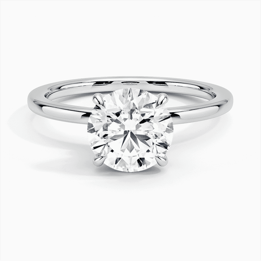 Förlovningsring i vitguld med dolt halo