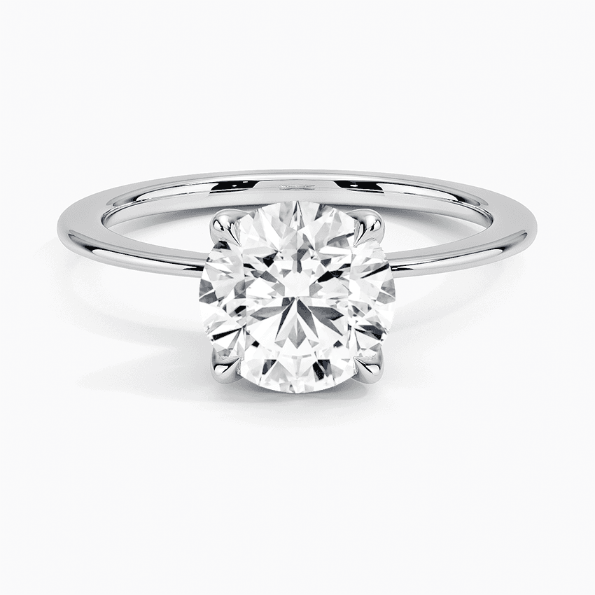 Förlovningsring i vitguld med dolt halo