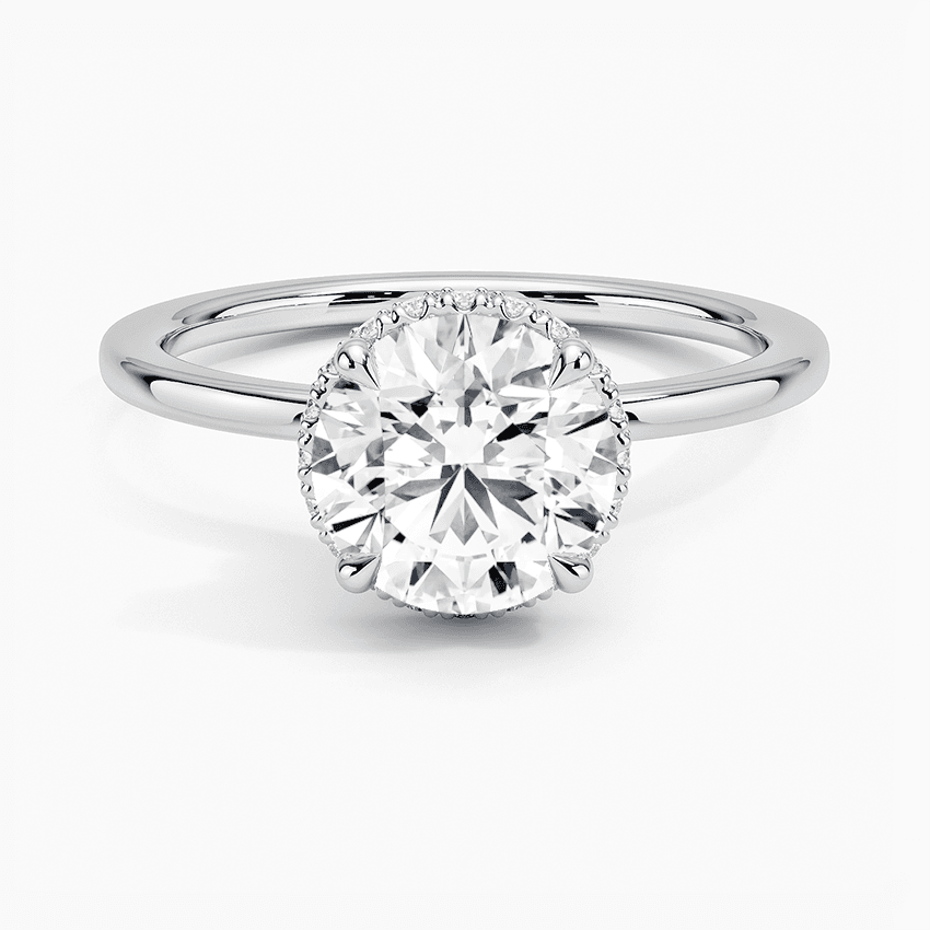 Förlovningsring i vitguld med dolt halo