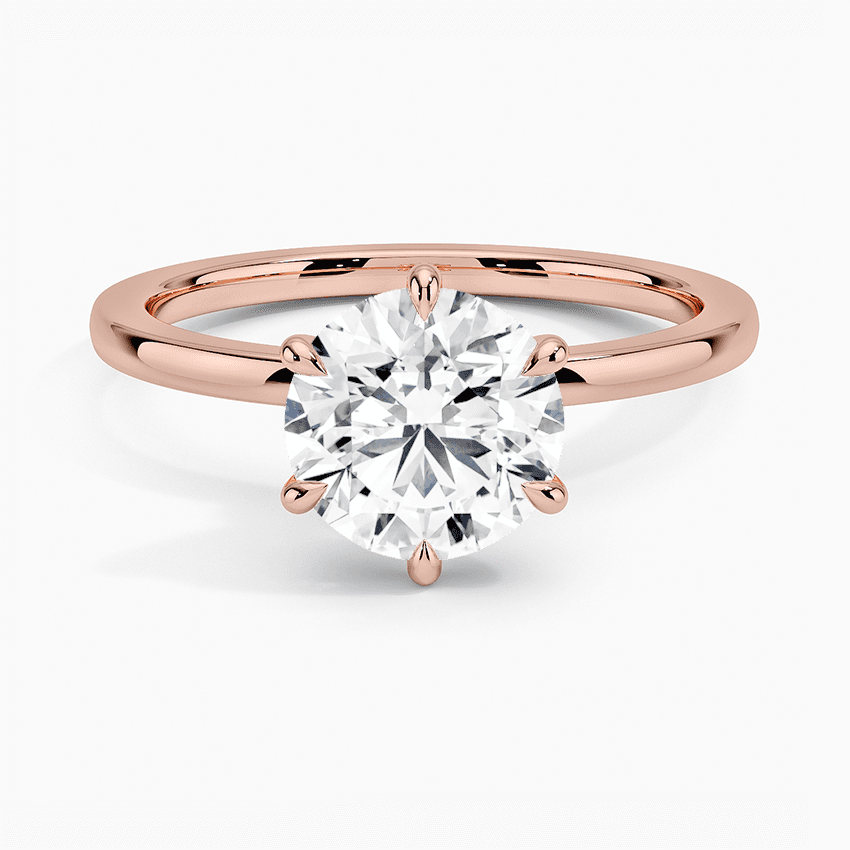 Förlovningsring i roséguld med dolt halo