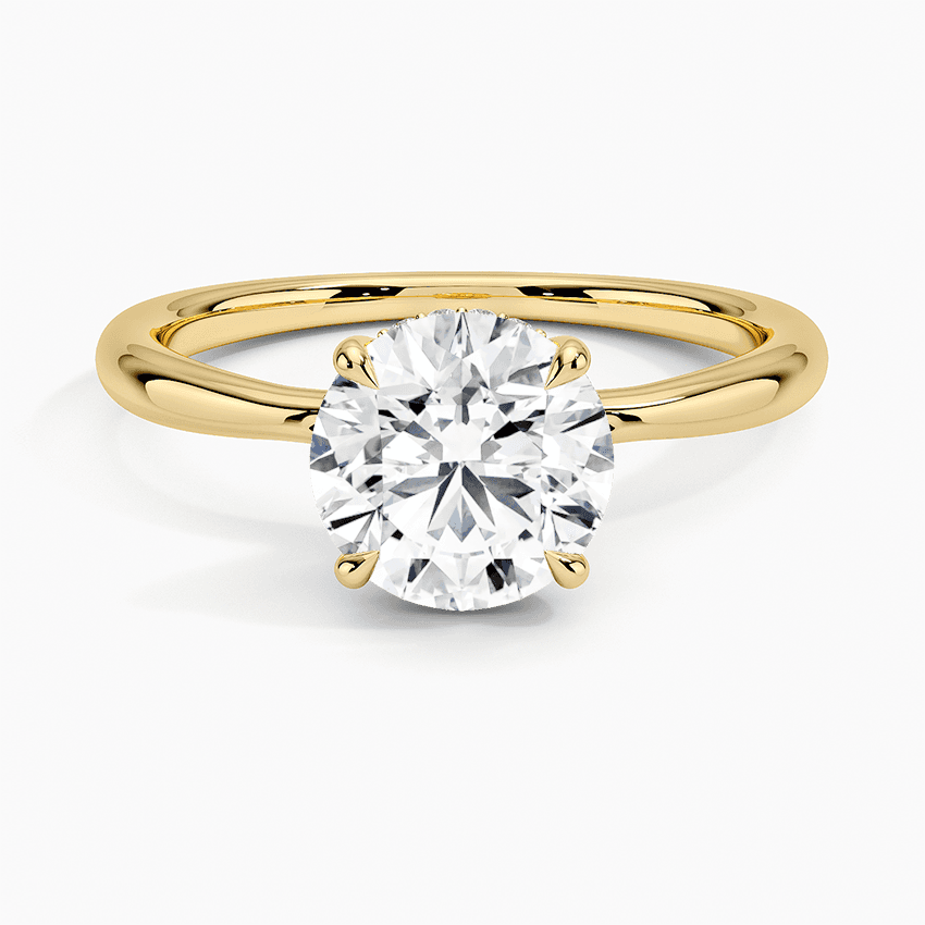 Förlovningsring i rödguld med dold halo