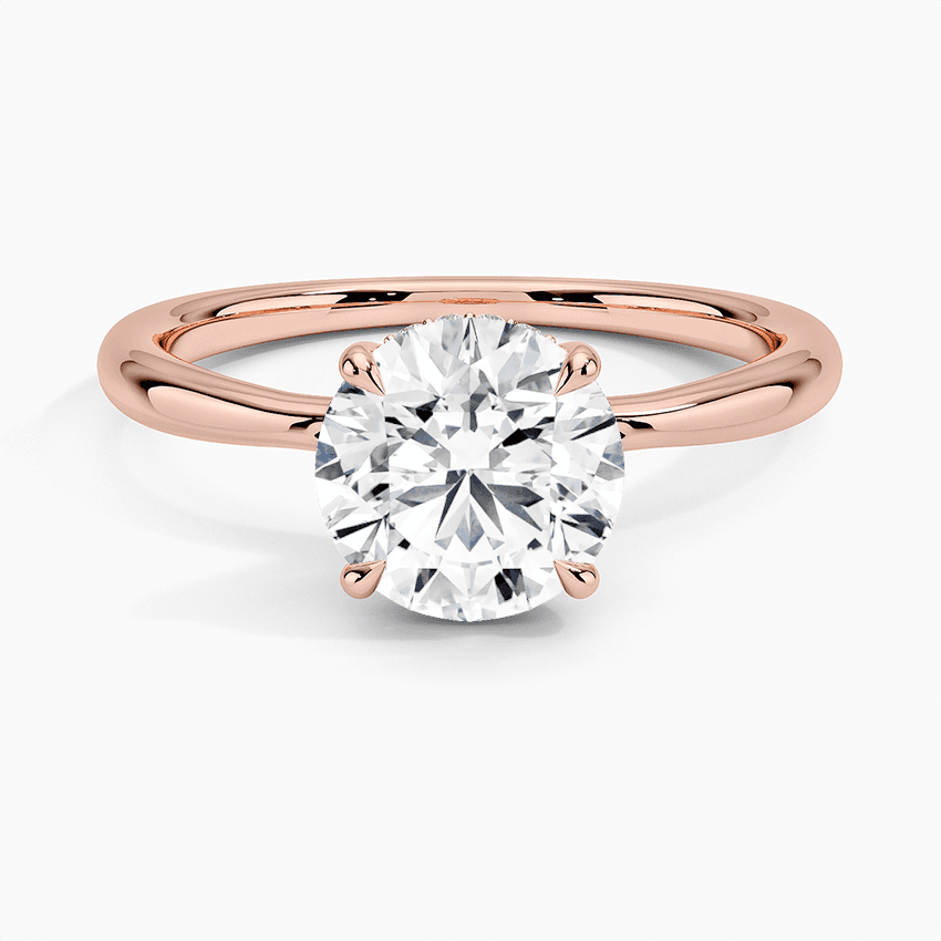 Förlovningsring i roséguld med dolt halo