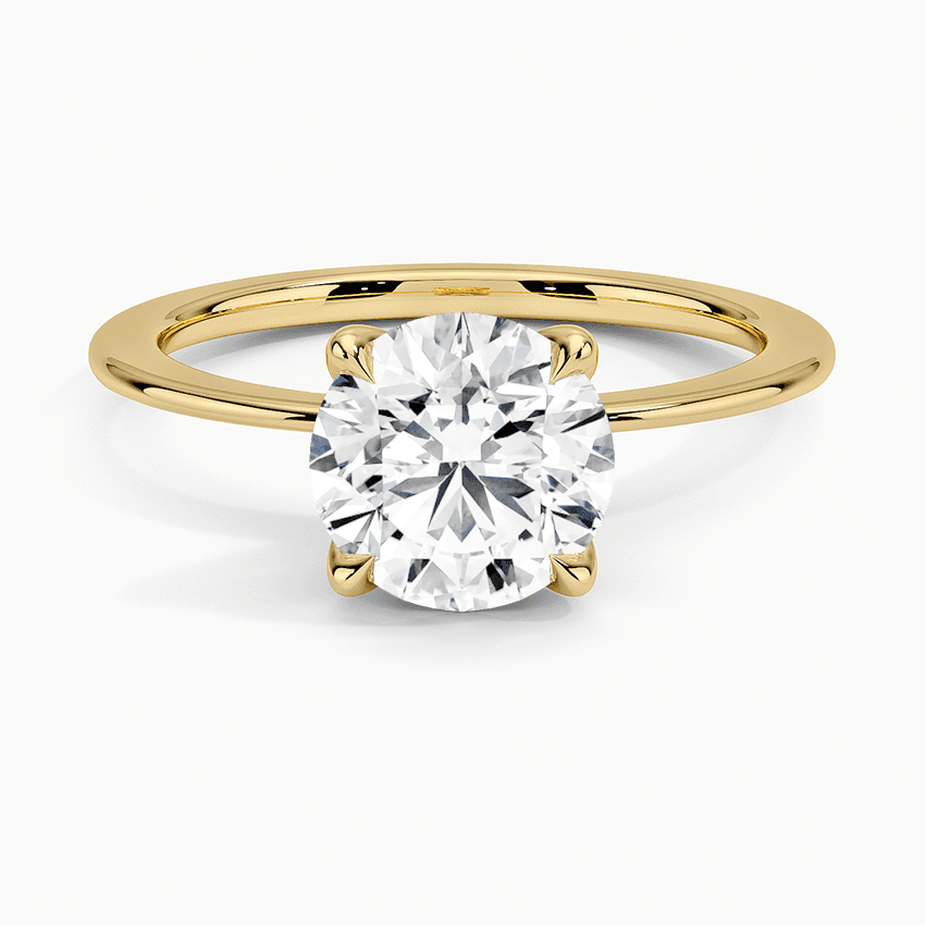 Förlovningsring i rödguld med dolt halo