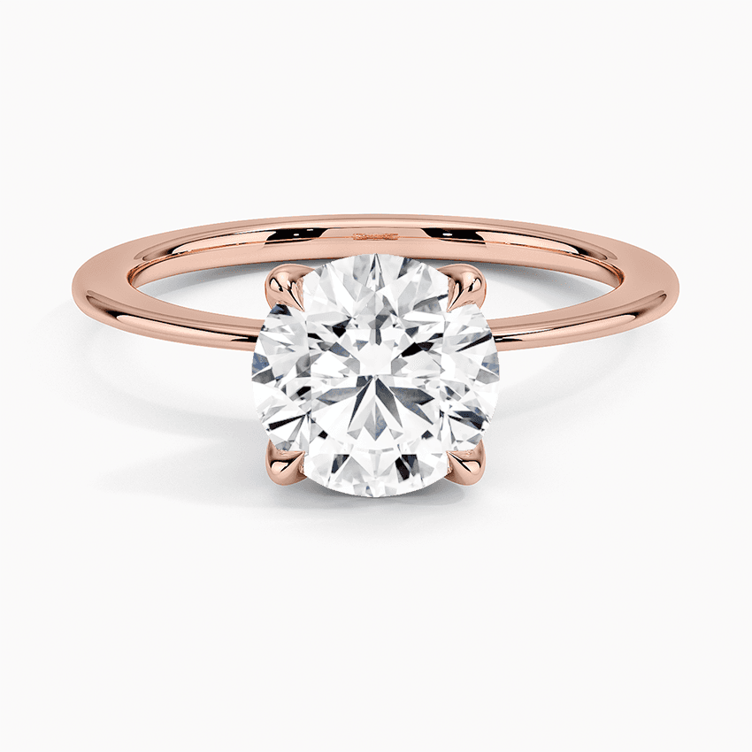 Förlovningsring i roséguld med dolt halo