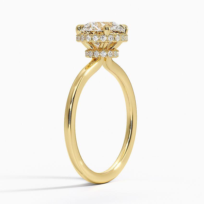 Förlovningsring i rödguld med dolt halo